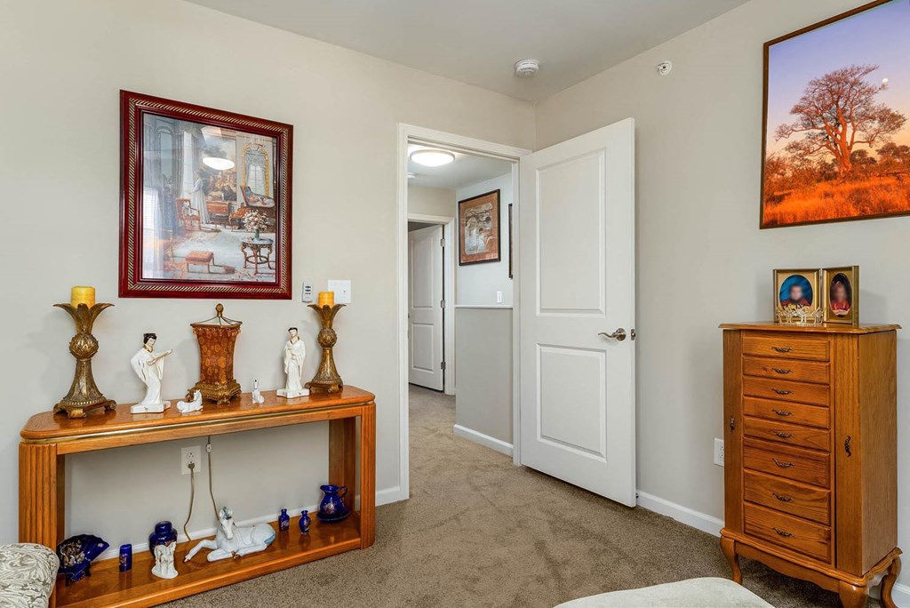 a bedroom with a bed and a dresser