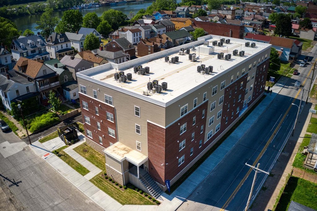 a large brick building with a white roof
