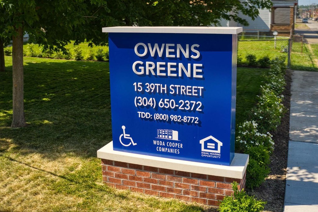 a sign in front of a building