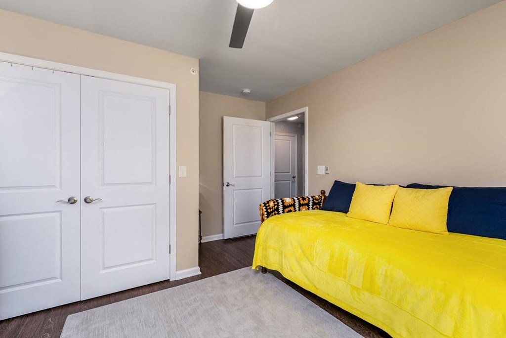 a bedroom with a bed and two doors