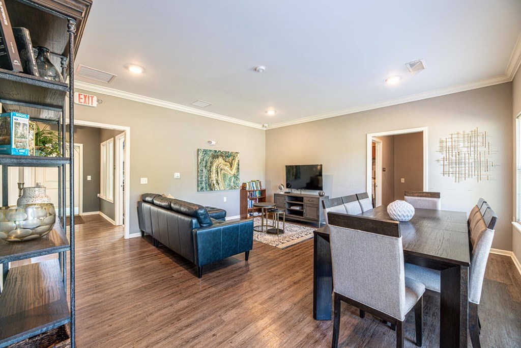 A living room with a blue couch and a television.
