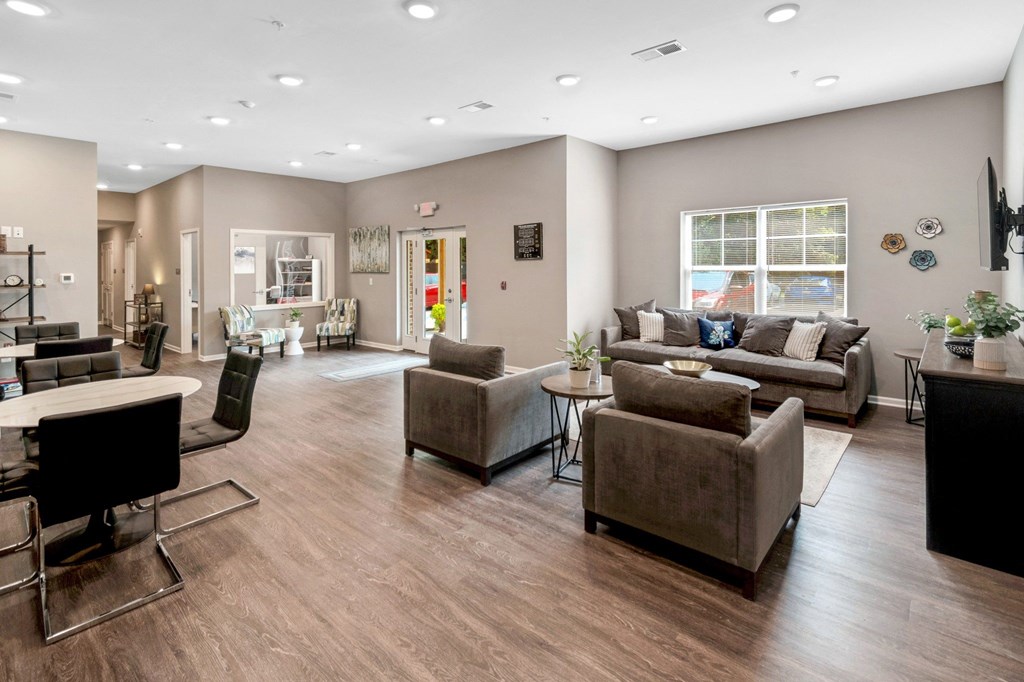 a living room with couches and chairs and a table