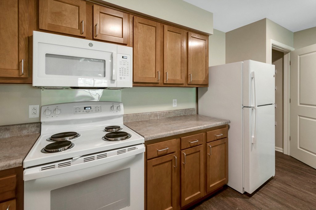 a kitchen with a stove microwave and refrigerator