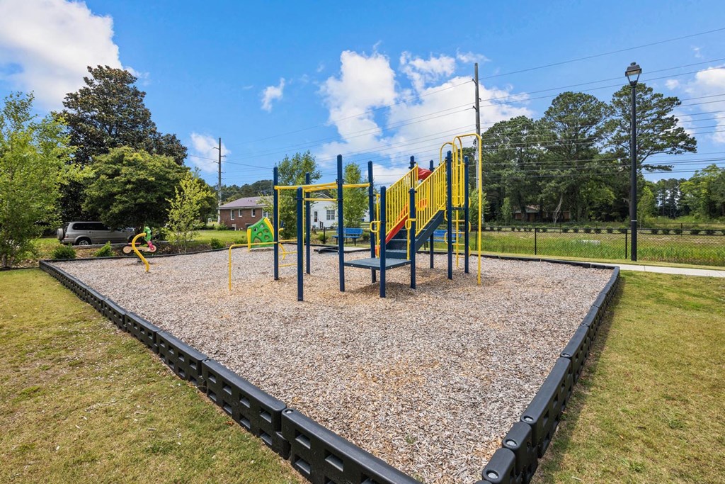 a playground in a park on a sunny day