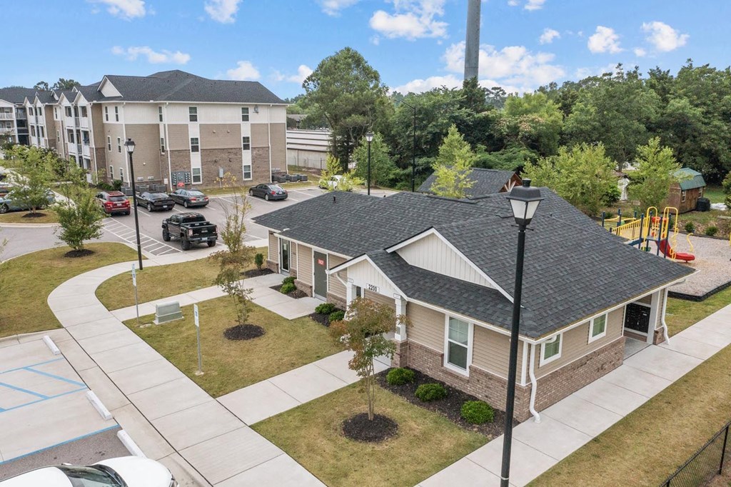 an aerial view of a neighborhood with houses and a playground
