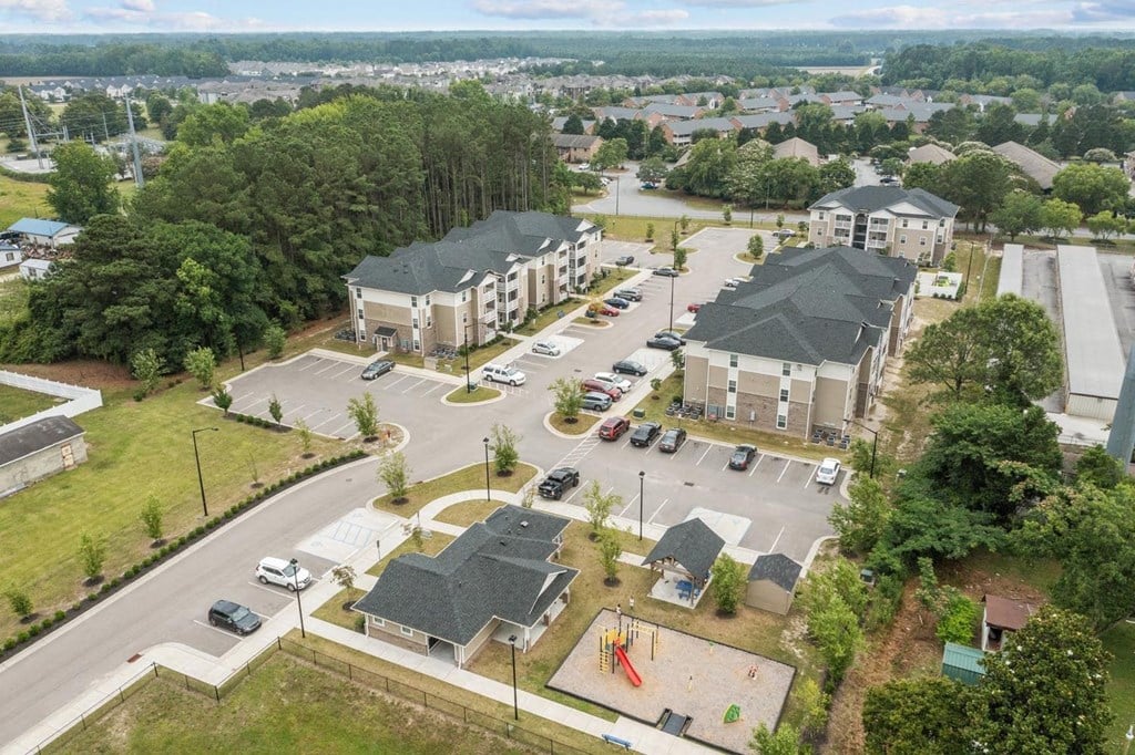 an aerial view of a neighborhood of houses in a city street