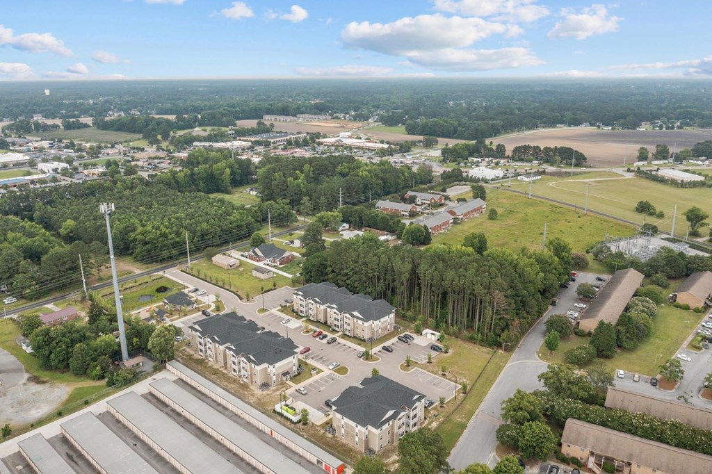 an aerial view of a city with buildings and trees