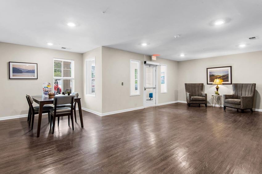 a living and dining room area with a table and chairs - Photo Gallery