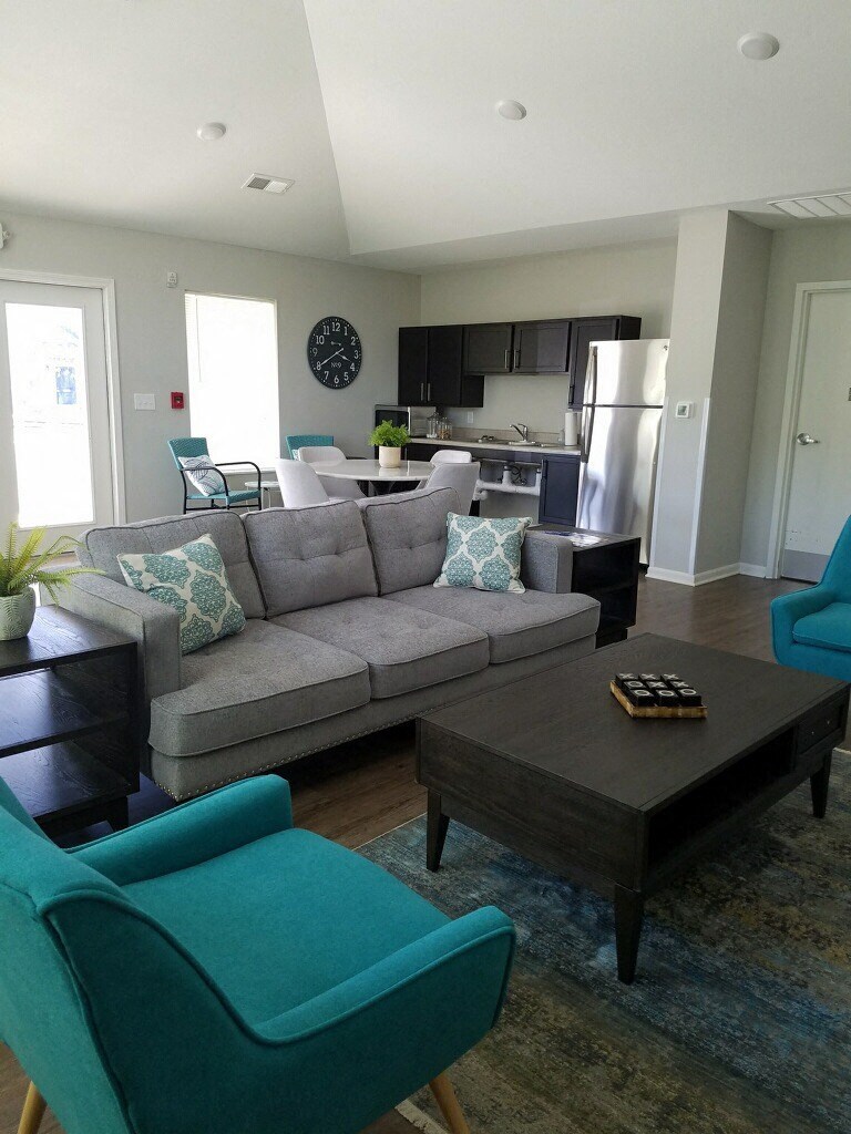 a living room with a couch and a table