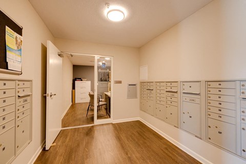 a room with many filing cabinets and a dining room with a table