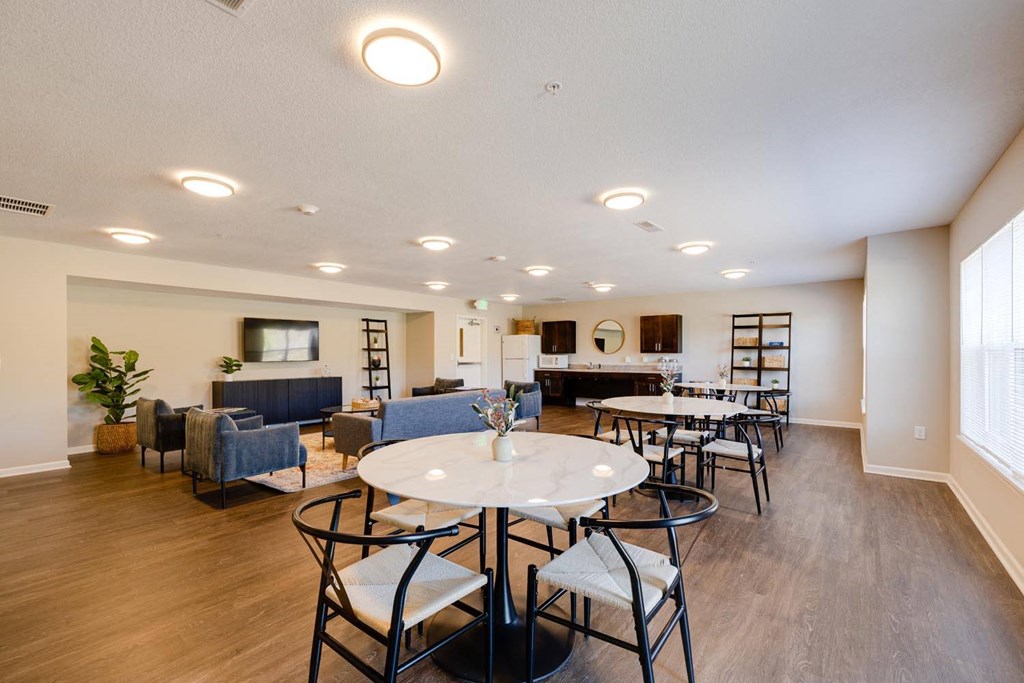 the reserve at bucklin hill clubhouse with tables and chairs