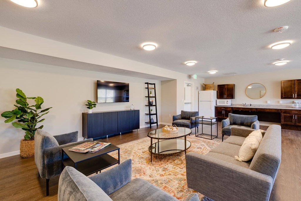 a living room with couches chairs and a coffee table