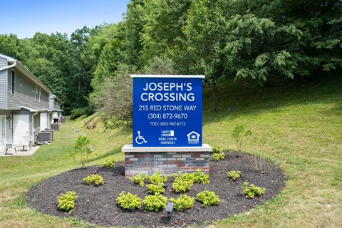a sign in front of a house