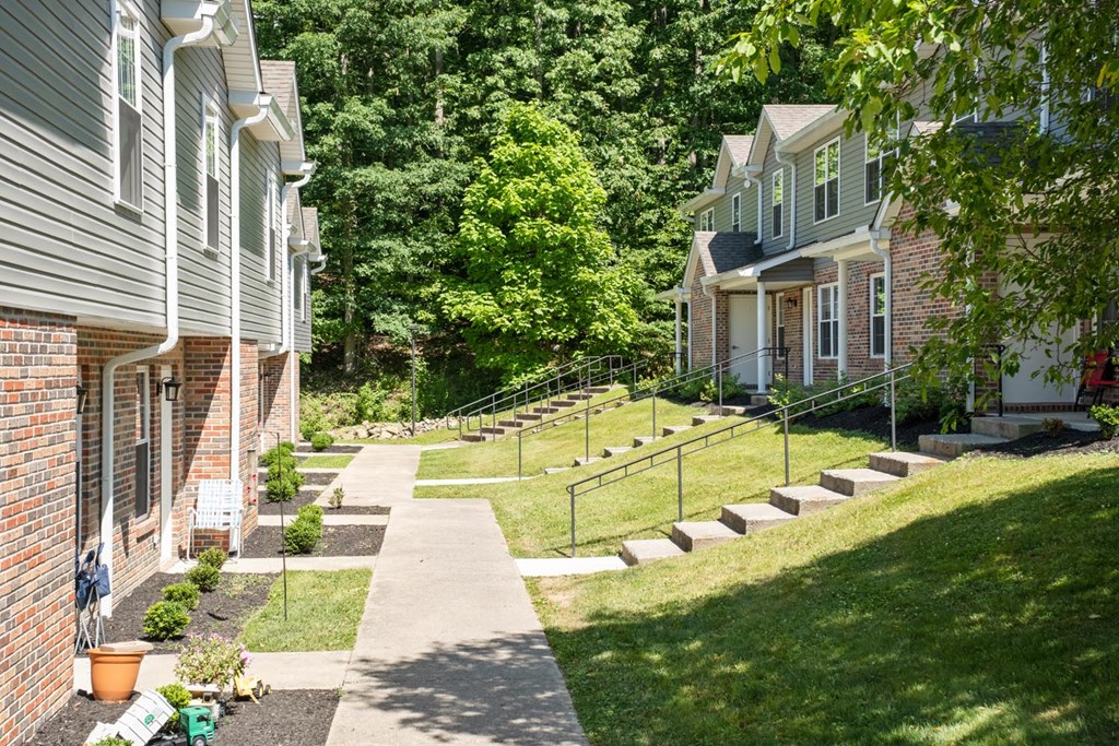 a yard with stairs leading up to a house