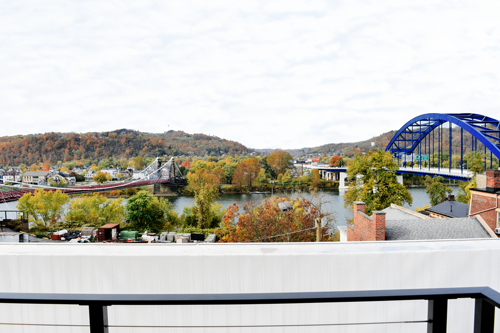 a view of a bridge over a river and a building