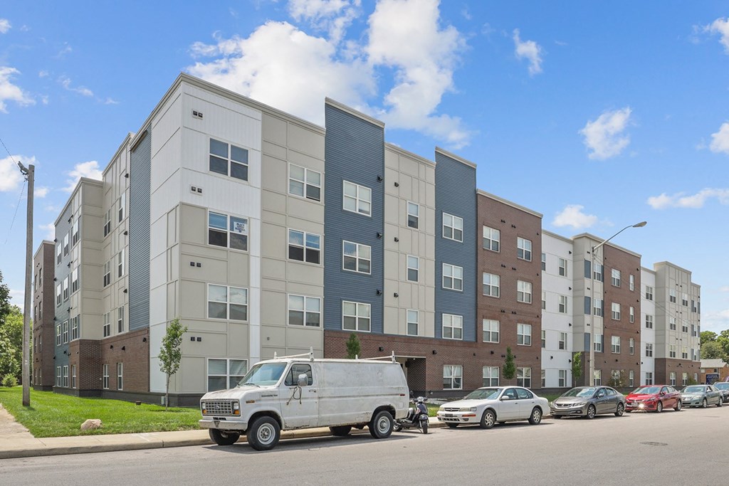 a van parked in front of an apartment building
