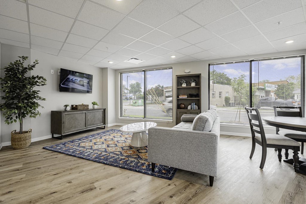 a living room with a couch and a table and a tv
