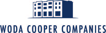 A blue and white logo of a building with the text "WODA COOPER COMPANIES" below it.