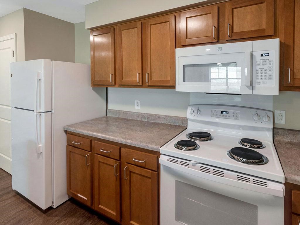 a kitchen with a stove microwave and refrigerator