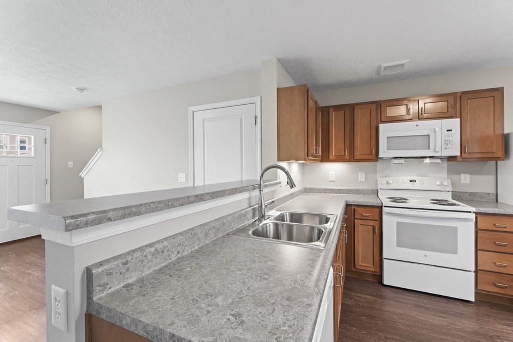 a kitchen with a counter top and a sink