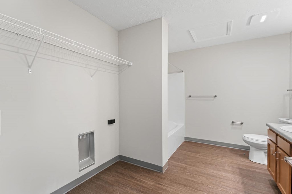 a bathroom with a toilet and a shower and a sink