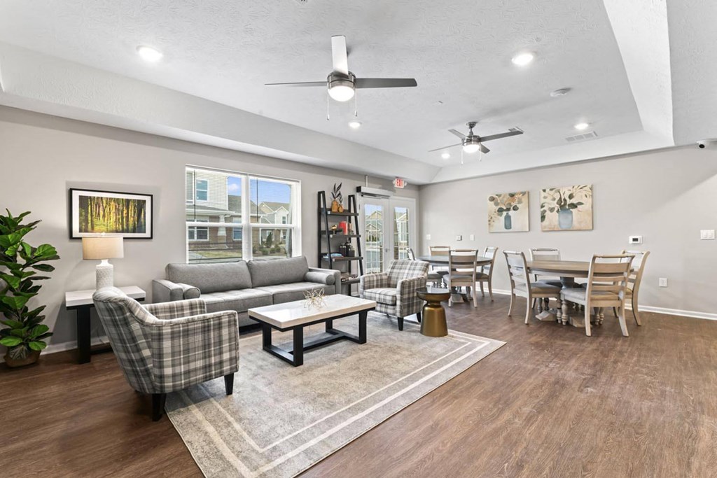 a living room with a couch and a dining room table