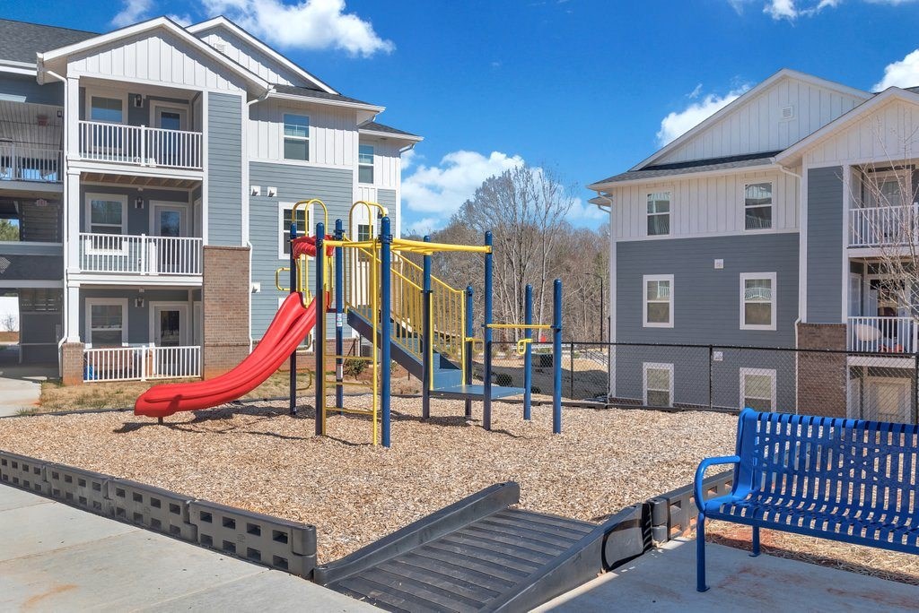 our apartments have a playground and a picnic table