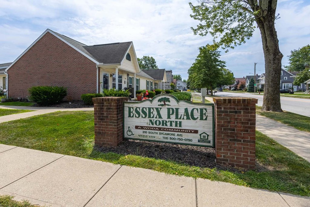 A sign for Essex Place North in front of some houses.