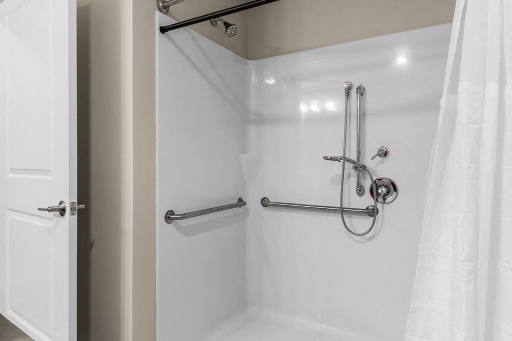 a bathroom with a shower and a shower curtain