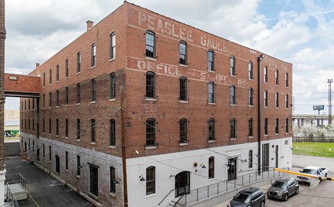 Exterior of Painters Row Apartments, a historic brick building in downtown Louisville, Kentucky.