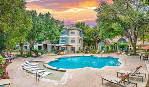 A large house with a pool in the backyard.
