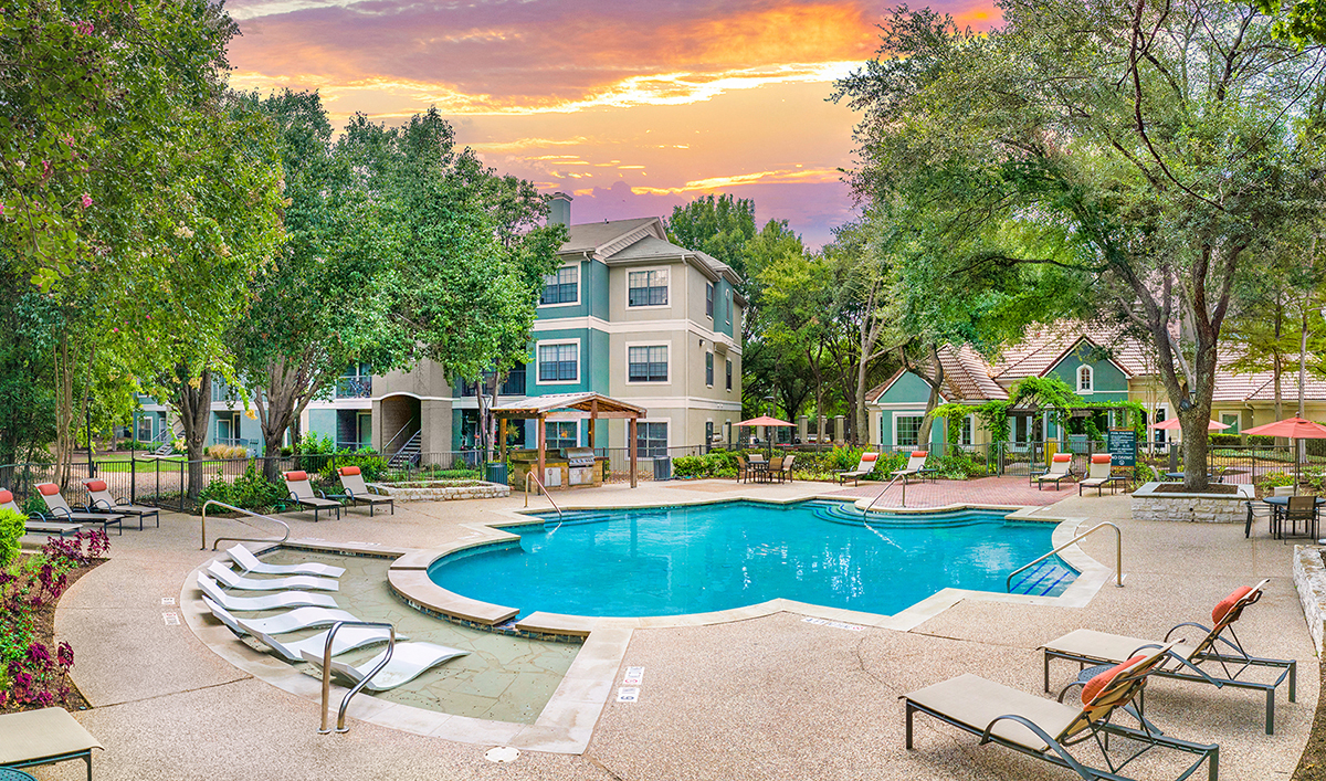 A large house with a pool in the backyard.