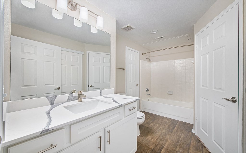 an empty bathroom with a sink and a toilet