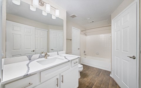 an empty bathroom with a sink and a toilet