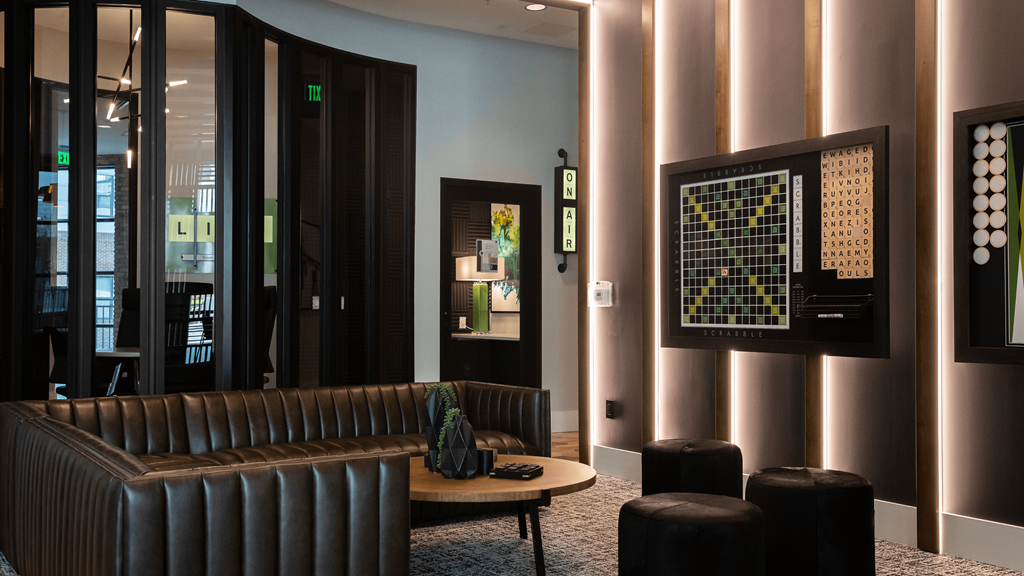 a lobby of a hotel with a couch and a table