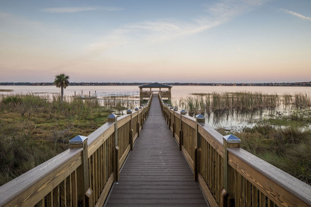 a dock with a bridge over a body of water