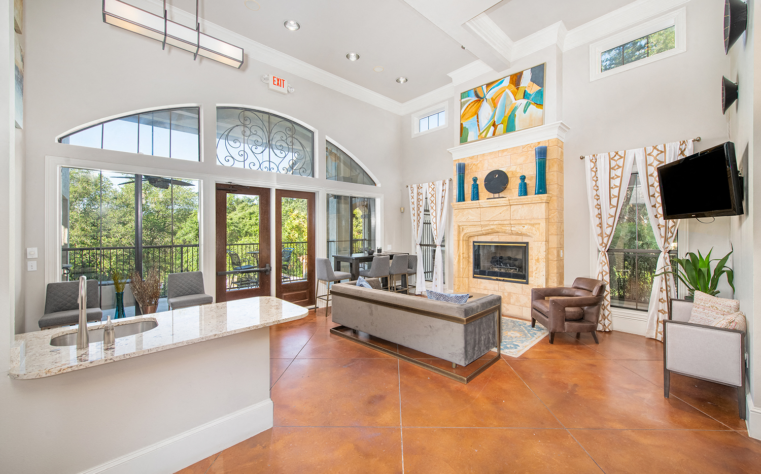 A living room with a fireplace and a television.