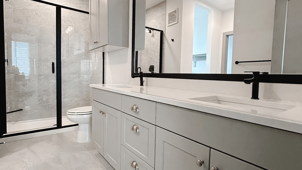 a bathroom with a sink and a toilet and a shower