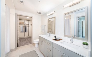 Sleek bathrooms with ample storage. - Photo Gallery 29