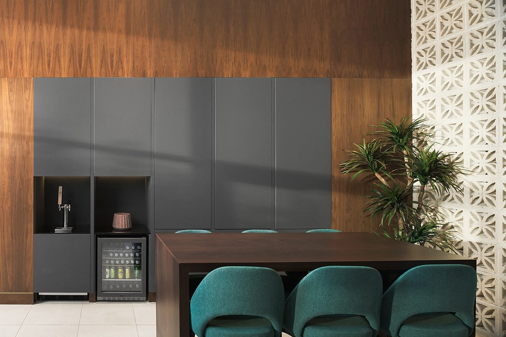 a conference room with green chairs and a table