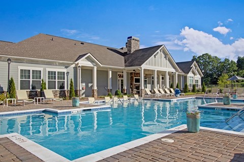 Outdoor resort-style pool with lounge seating and sundeck at York Woods at Lake Murray in Columbia, SC