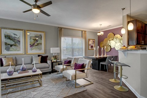Open-concept apartment living room and dining area at York Woods at Lake Murray near Lake Murray, SC