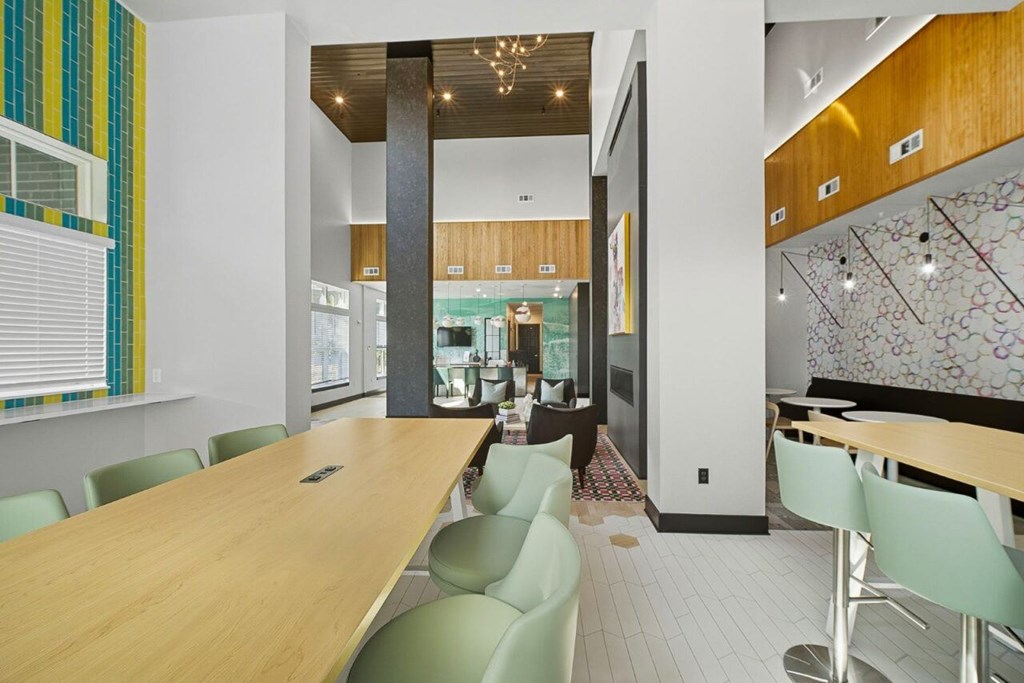 A conference room with a long table and chairs.