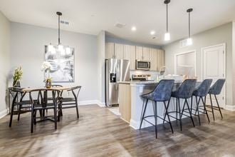 a kitchen and dining area in a 555 waverly unit