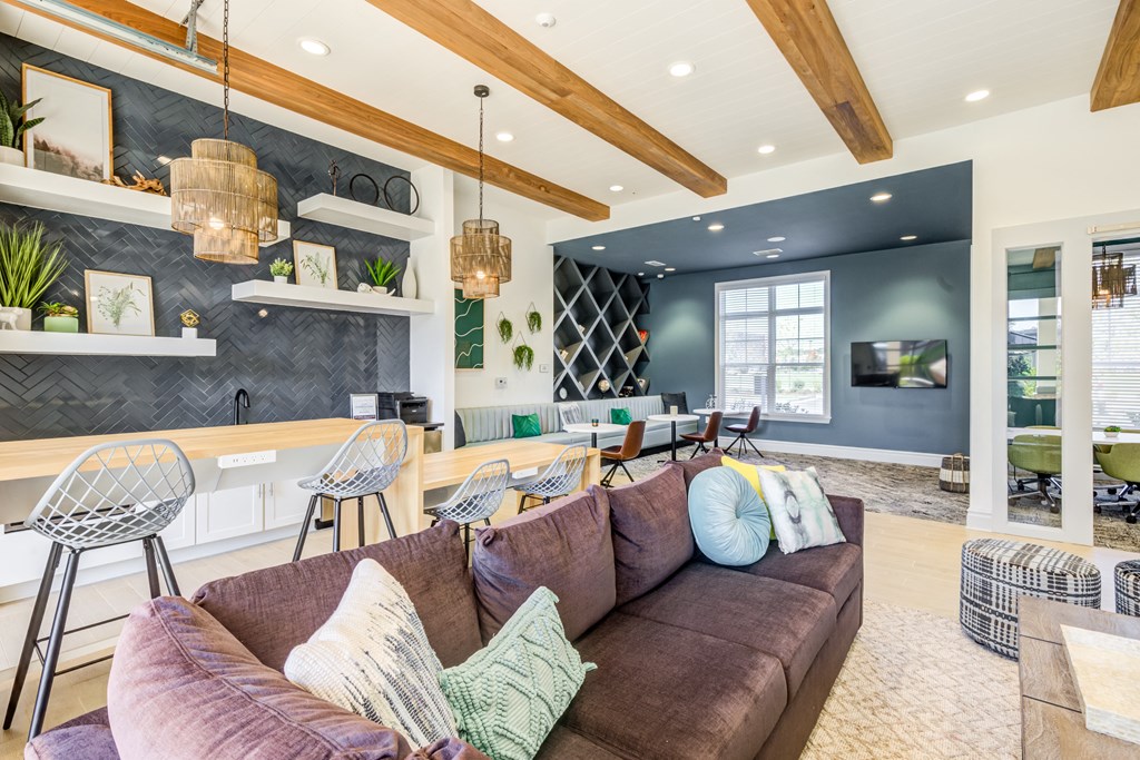 a living room with a couch and chairs