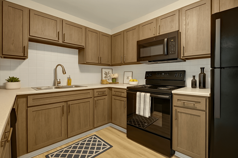 A kitchen with wooden cabinets and black appliances.