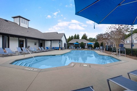 Resort-style swimming pool with sundeck and lounge seating at Icon Cartersville in Cartersville, GA