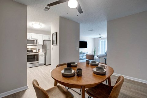 Open-concept apartment living room, dining area and kitchen at Icon Cartersville in Cartersville, GA