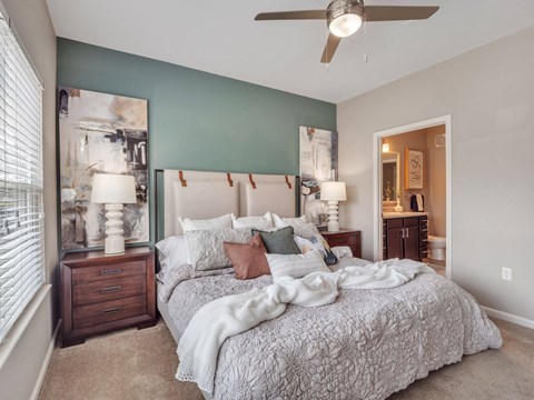 Primary bedroom with adjoining bathroom at Enclave at Bailes Ridge in Indian Land, SC