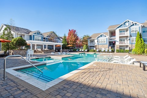 Resort-style swimming pool with spacious sundeck at Enclave at Bailes Ridge in Indian Land, SC
